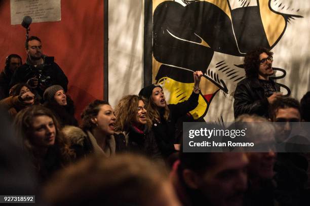 Party militants Power to the world within the former EX OGP social center during the counting of the paper ballots on March 4, 2018 in Naples, Italy....