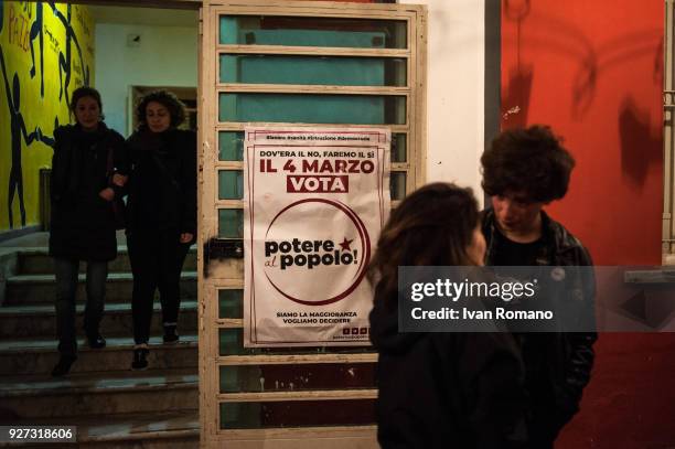 Party militants Power to the world within the former EX OGP social center during the counting of the paper ballots on March 4, 2018 in Naples, Italy....