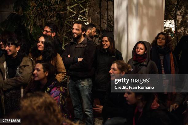 Party militants Power to the world within the former EX OGP social center during the counting of the paper ballots on March 4, 2018 in Naples, Italy....