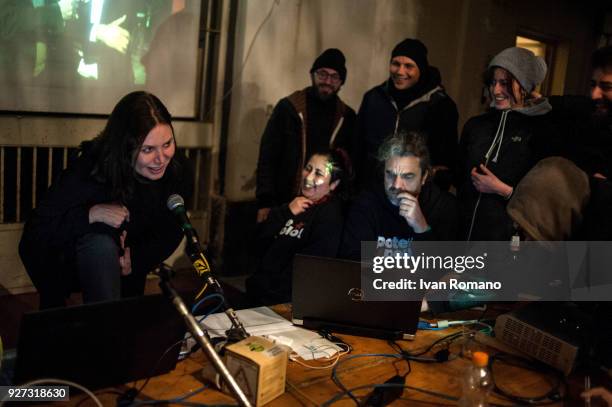 Party militants Power to the world within the former EX OGP social center during the counting of the paper ballots on March 4, 2018 in Naples, Italy....