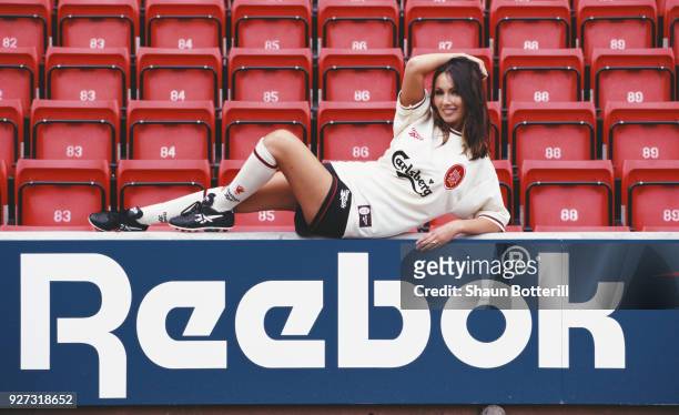 Model Kathy Lloyd poses in the new Liverpool change kit at the launch of the 1996/97 season Reebok strip at Anfield on July 8, 1996 in Liverpool,...