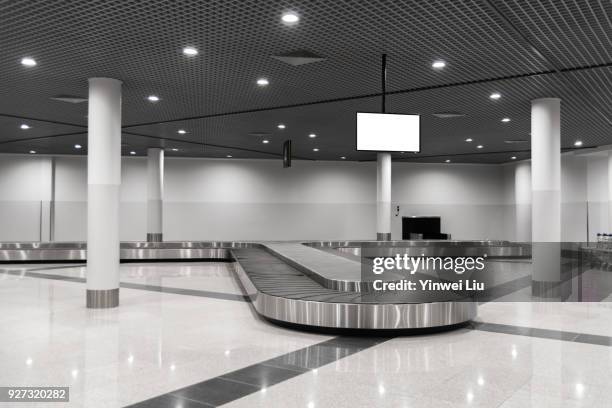 billboard at baggage claim - baggage claim stock pictures, royalty-free photos & images