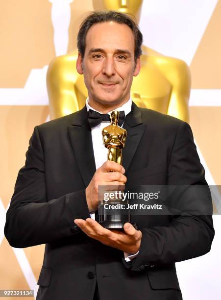 Composer Alexandre Desplat winner of the Best Original Music Score for "Shape of Water" poses in the press room during the 90th Annual Academy Awards...