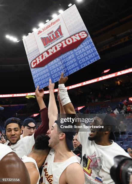 Loyola players celebrate after winning the Missouri Valley Conference Basketball Tournament championship game between Loyola Ramblers and Illinois...