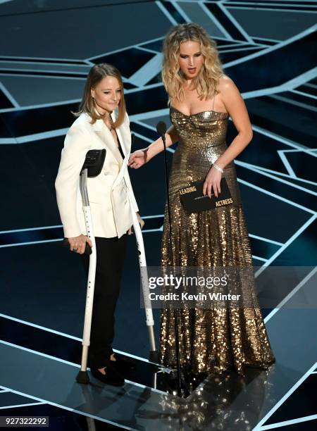 Actors Jodie Foster and Jennifer Lawrence speak onstage during the 90th Annual Academy Awards at the Dolby Theatre at Hollywood & Highland Center on...