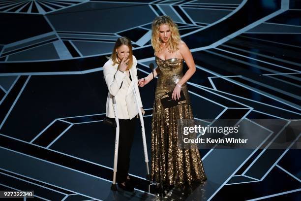 Actors Jodie Foster and Jennifer Lawrence speak onstage during the 90th Annual Academy Awards at the Dolby Theatre at Hollywood & Highland Center on...