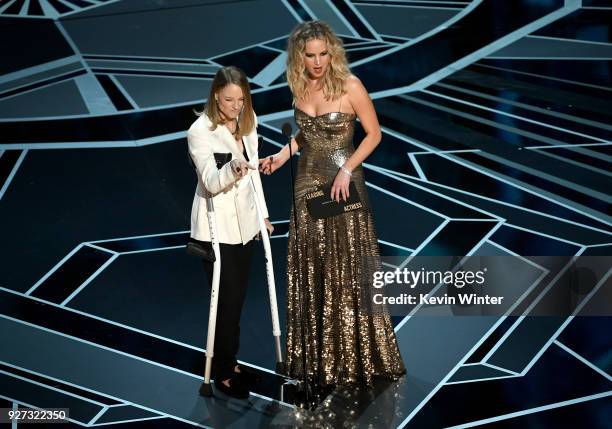 Actors Jodie Foster and Jennifer Lawrence speak onstage during the 90th Annual Academy Awards at the Dolby Theatre at Hollywood & Highland Center on...