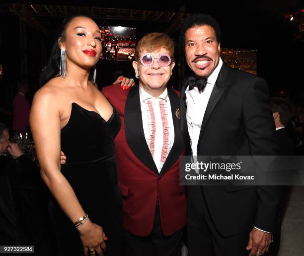 Lisa Parigi, Sir Elton John, and Lionel Richie attend the 26th annual Elton John AIDS Foundation Academy Awards Viewing Party sponsored by Bulgari,...