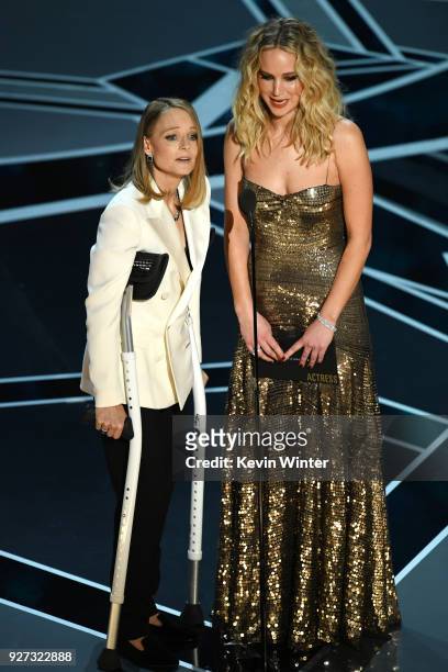 Actors Jodie Foster and Jennifer Lawrence speak onstage during the 90th Annual Academy Awards at the Dolby Theatre at Hollywood & Highland Center on...