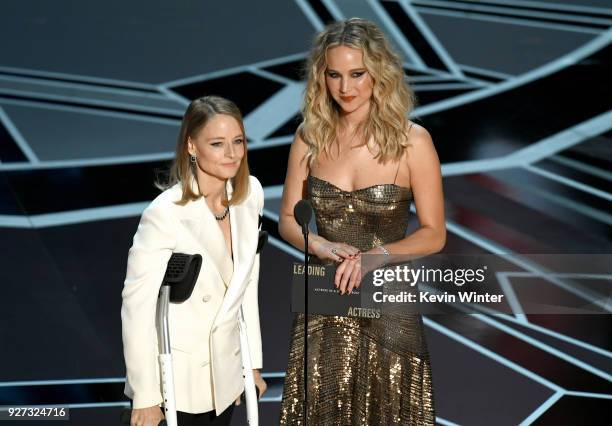 Actors Jodie Foster and Jennifer Lawrence speak onstage during the 90th Annual Academy Awards at the Dolby Theatre at Hollywood & Highland Center on...
