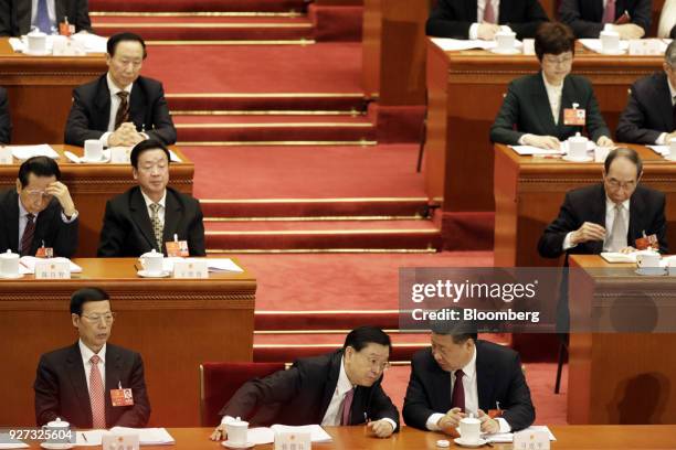 Xi Jinping, China's president, front row right, speaks with Zhang Dejiang, chairman of the Standing Committee of the National People's Congress ,...