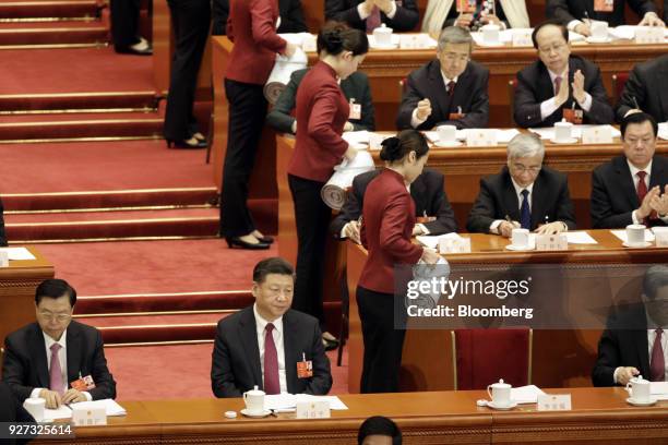 Xi Jinping, China's president, front row second left, and Zhang Dejiang, chairman of the Standing Committee of the National People's Congress , front...