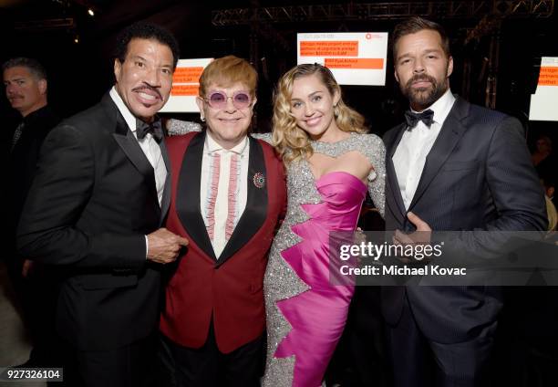 Lionel Richie, Sir Elton John, Miley Cyrus, and Ricky Martin attend the 26th annual Elton John AIDS Foundation Academy Awards Viewing Party sponsored...