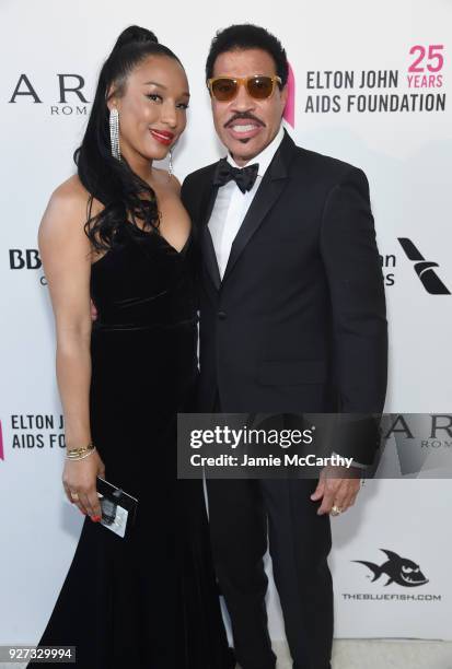 Lisa Parigi and Lionel Richie attend the 26th annual Elton John AIDS Foundation Academy Awards Viewing Party sponsored by Bulgari, celebrating EJAF...