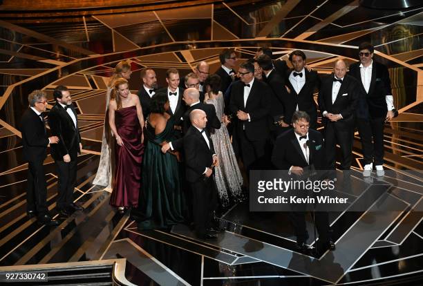 Producer J. Miles Dale , director Guillermo del Toro and cast/crew accept Best Picture for 'The Shape of Water' onstage during the 90th Annual...