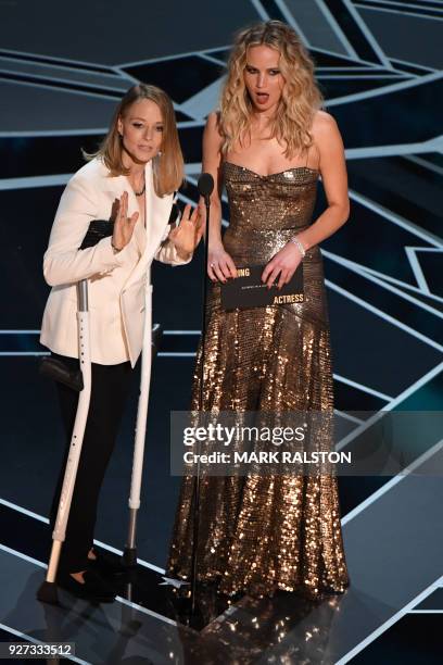 Actresses Jodie Foster and Jennifer Lawrence present the Oscar for Best Actress during the 90th Annual Academy Awards show on March 4, 2018 in...