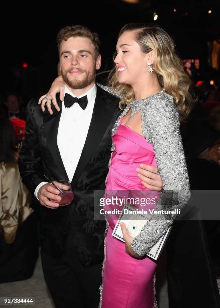 Gus Kenworthy and Miley Cyrus attend Elton John AIDS Foundation 26th Annual Academy Awards Viewing Party at The City of West Hollywood Park on March...