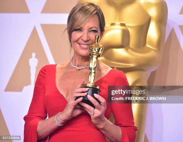 Actress Allison Janney poses in the press room with the Oscar for best actress in a supporting role during the 90th Annual Academy Awards on March 4...