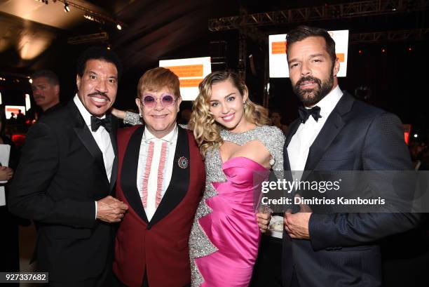 Lionel Richie, Sir Elton John, Miley Cyrus, and Ricky Martin attend the 26th annual Elton John AIDS Foundation Academy Awards Viewing Party sponsored...