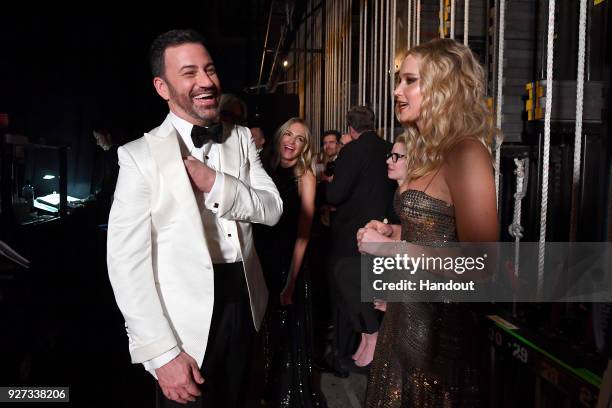 In this handout provided by A.M.P.A.S., Jimmy Kimmel and Jennifer Lawrence attend the 90th Annual Academy Awards at the Dolby Theatre on March 4,...