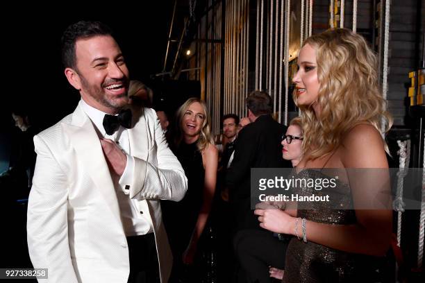 In this handout provided by A.M.P.A.S., Jimmy Kimmel and Jennifer Lawrence attend the 90th Annual Academy Awards at the Dolby Theatre on March 4,...