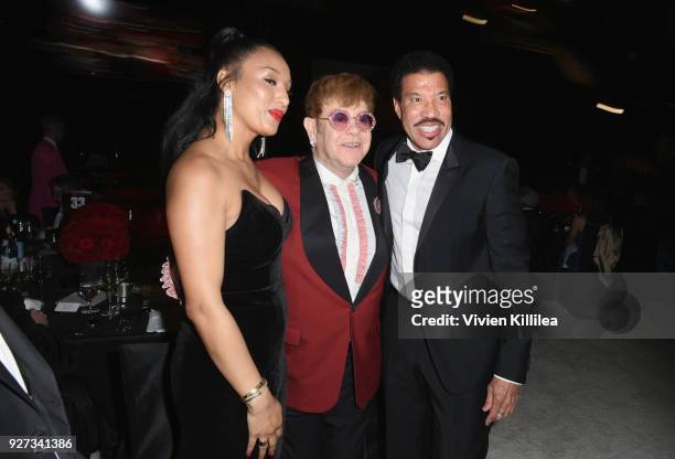 Lisa Parigi, Sir Elton John and Lionel Richie attend the 26th annual Elton John AIDS Foundation Academy Awards Viewing Party with cocktails by Clase...