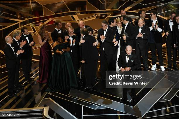 Producer J. Miles Dale and cast/crew accept Best Picture for 'The Shape of Water' onstage during the 90th Annual Academy Awards at the Dolby Theatre...