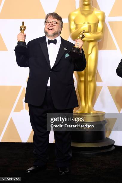 Filmmaker Guillermo del Toro, winner of the Best Director and Best Picture awards for 'The Shape of Water,' poses in the press room during the 90th...