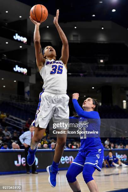 DePaul Blue Demons forward Mart'e Grays shoots over Seton Hall Pirates guard Nicole Jimenez during the game on March 4, 2018 at the Wintrust Arena in...