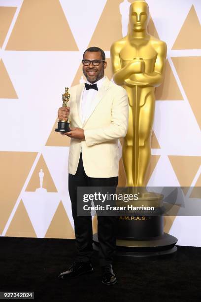 Writer Jordan Peele, winner of the Best Original Screenplay award for 'Get Out,' poses in the press room during the 90th Annual Academy Awards at...