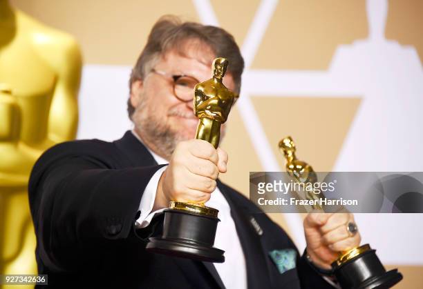 Filmmaker Guillermo del Toro, winner of the Best Director and Best Picture awards for 'The Shape of Water,' poses in the press room during the 90th...