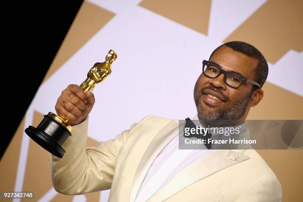Writer Jordan Peele, winner of the Best Original Screenplay award for 'Get Out,' poses in the press room during the 90th Annual Academy Awards at...