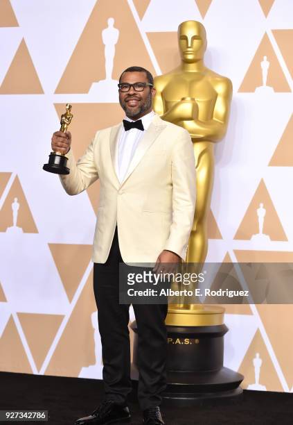 Writer Jordan Peele, winner of the Best Original Screenplay award for 'Get Out,' poses in the press room during the 90th Annual Academy Awards at...