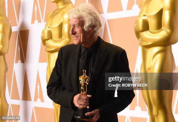 Cinematographer Roger A. Deakins poses in the press room with the Oscar for Best Cinematography for "Blade Runner 2049" during the 90th Annual...