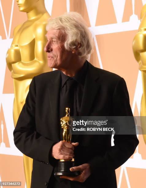 Cinematographer Roger A. Deakins poses in the press room with the Oscar for Best Cinematography for "Blade Runner 2049" during the 90th Annual...