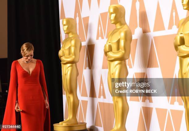 Actress Allison Janney poses in the press room with the Oscar for Best Supporting Actress in "I, Tonya" during the 90th Annual Academy Awards on...