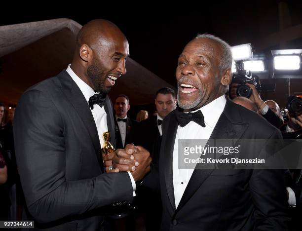 Filmmaker Kobe Bryant , winner of the Best Animated Short Film award for 'Dear Basketball,' and actor Danny Glover attend the 90th Annual Academy...