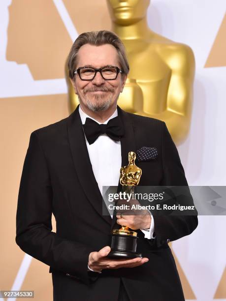 Actor Gary Oldman, winner of the Best Actor award for 'Darkest Hour,' poses in the press room during the 90th Annual Academy Awards at Hollywood &...