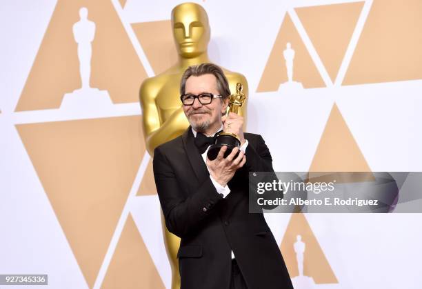 Actor Gary Oldman, winner of the Best Actor award for 'Darkest Hour,' poses in the press room during the 90th Annual Academy Awards at Hollywood &...