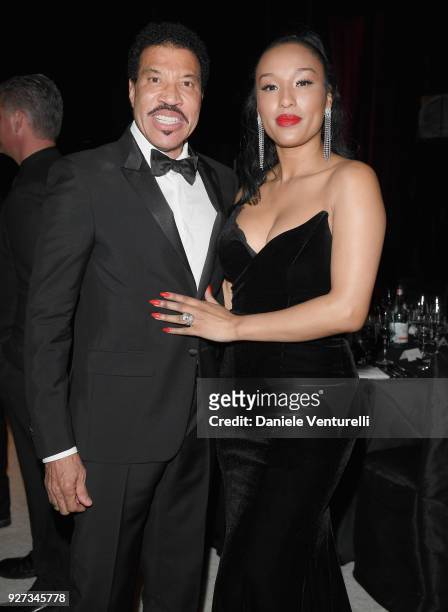 Lionel Richie and Lisa Parigi attend Elton John AIDS Foundation 26th Annual Academy Awards Viewing Party at The City of West Hollywood Park on March...