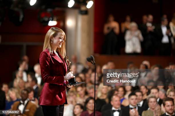 In this handout provided by A.M.P.A.S., Emma Stone attends the 90th Annual Academy Awards at the Dolby Theatre on March 4, 2018 in Hollywood,...