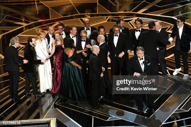 Producer J. Miles Dale , director Guillermo del Toro and cast/crew accept Best Picture for 'The Shape of Water' onstage during the 90th Annual...