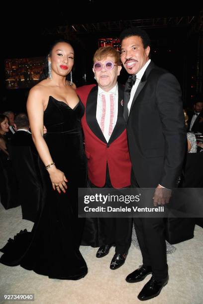 Lisa Parigi, Sir Elton John, and Lionel Richie attend Elton John AIDS Foundation 26th Annual Academy Awards Viewing Party at The City of West...