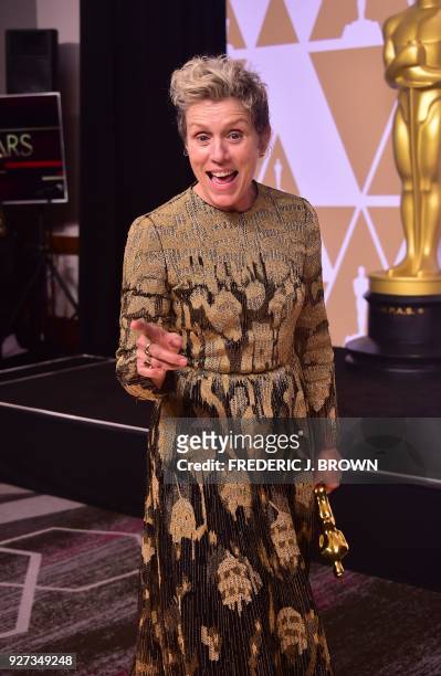 Actress Frances McDormand poses in the press room with the Oscar for best actress during the 90th Annual Academy Awards on March 4 in Hollywood,...
