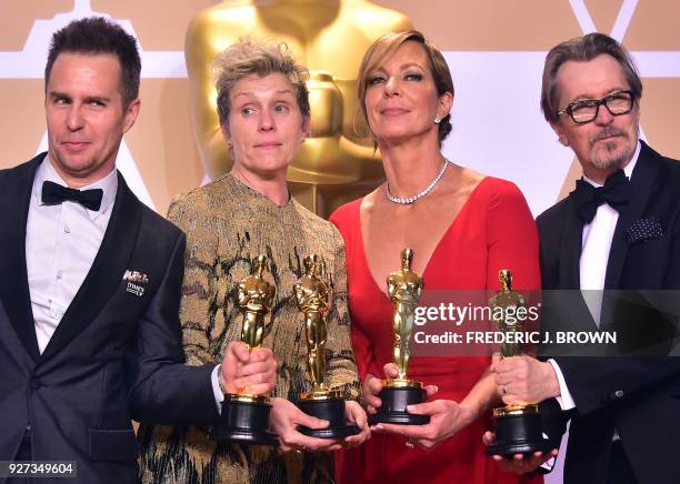 Actors Sam Rockwell, Frances McDormand, Allison Janney, and Gary Oldman, pose in the press room with their Oscars for best supporting actor, best...