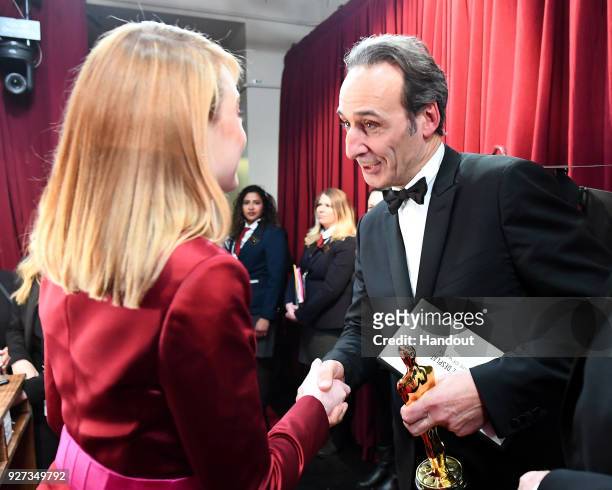 In this handout provided by A.M.P.A.S., composer Alexandre Desplat, winner of the Best Original Score award for 'The Shape of Water,' attends the...
