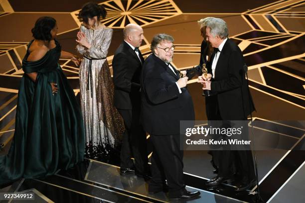 Producer J. Miles Dale and director Guillermo del Toro accept Best Picture for 'The Shape of Water' from actor Warren Beatty onstage during the 90th...