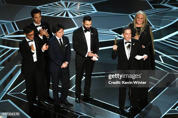 Actors Gael Garcia Bernal, Benjamin Bratt and Anthony Gonzalez, co-directors Adrian Molina and Lee Unkrich, and producer Darla K. Anderson accept...