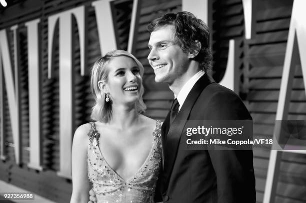Emma Roberts and Evan Peters attend the 2018 Vanity Fair Oscar Party hosted by Radhika Jones at Wallis Annenberg Center for the Performing Arts on...