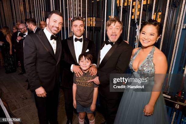 In this handout provided by A.M.P.A.S., host Jimmy Kimmel, actor Oscar Isaac, actor Mark Hamill, and actor Kelly Marie Tran pose with a guest at the...